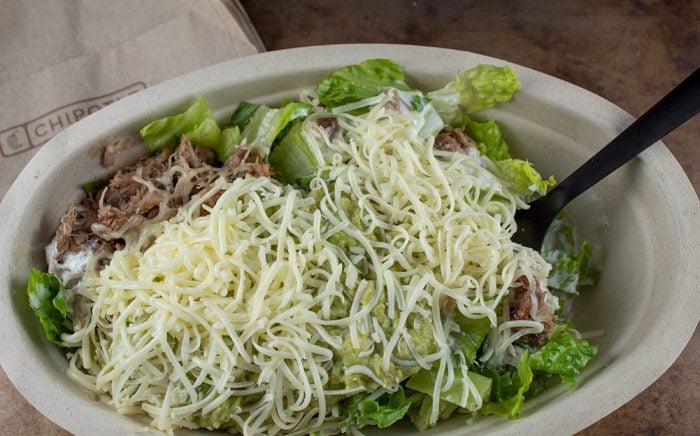 keto chipotle fat bomb bowl with a black fork sticking out and a napkin next to the bowl