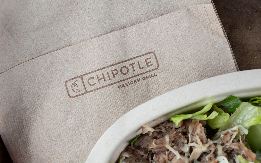 chipotle napkin next to a keto chipotle meal of carnitas and lettuce in a bowl