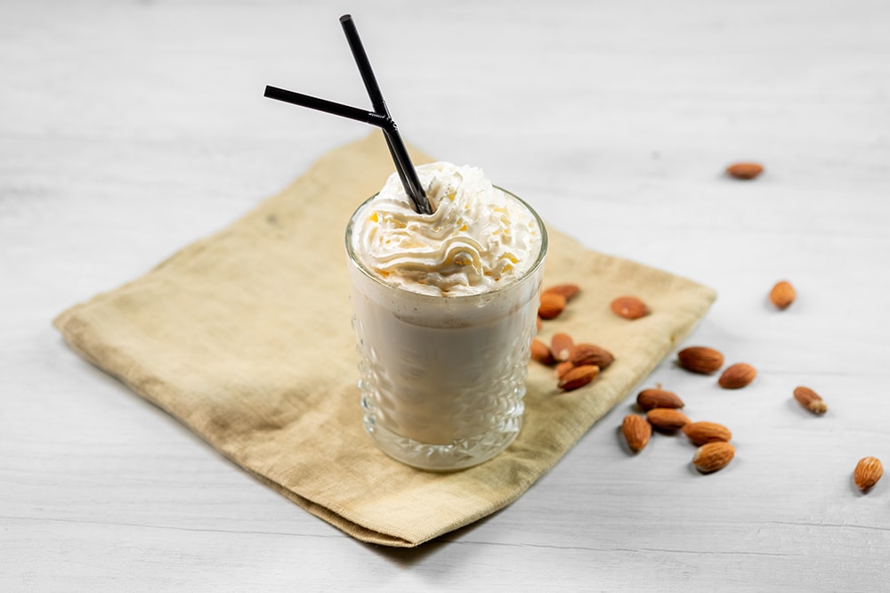 keto crack coffee keto coffee with almonds scattered about