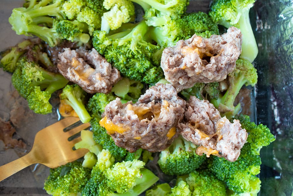 closeup of hotlogic mini butter burger meal prep with broccoli