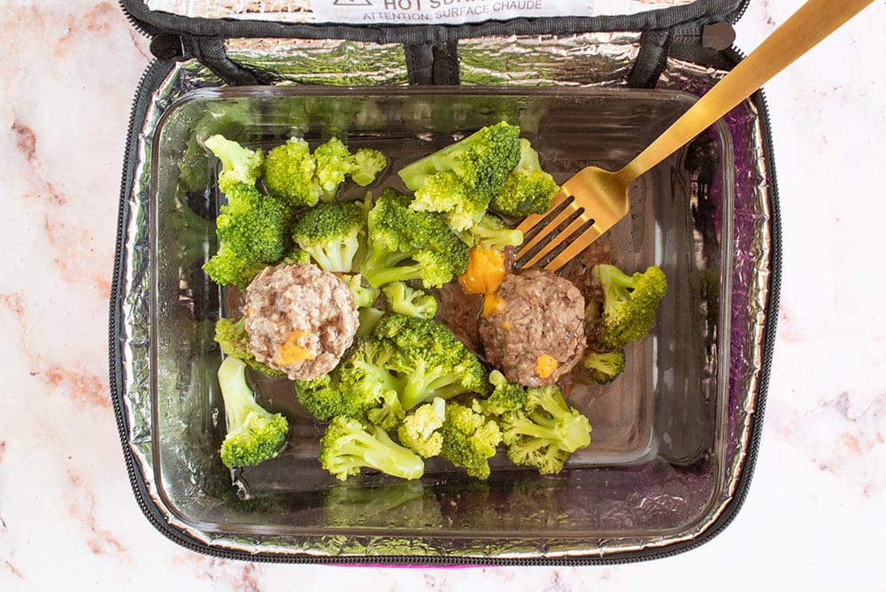 inside of hotlogic mini with broccoli and butter burgers with gold fork