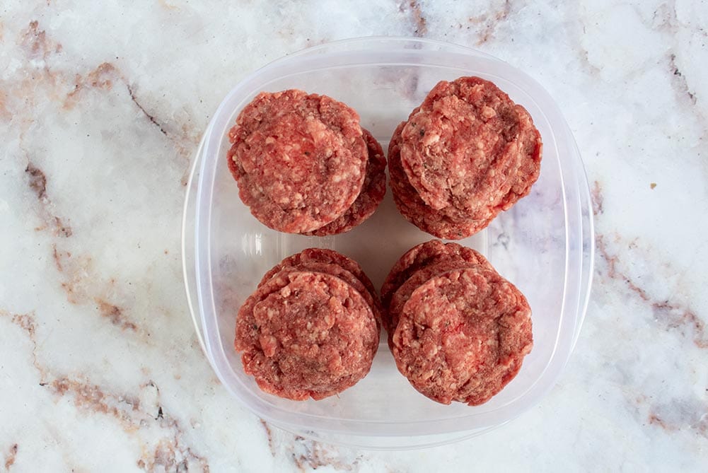 frozen butter burgers in a plastic container