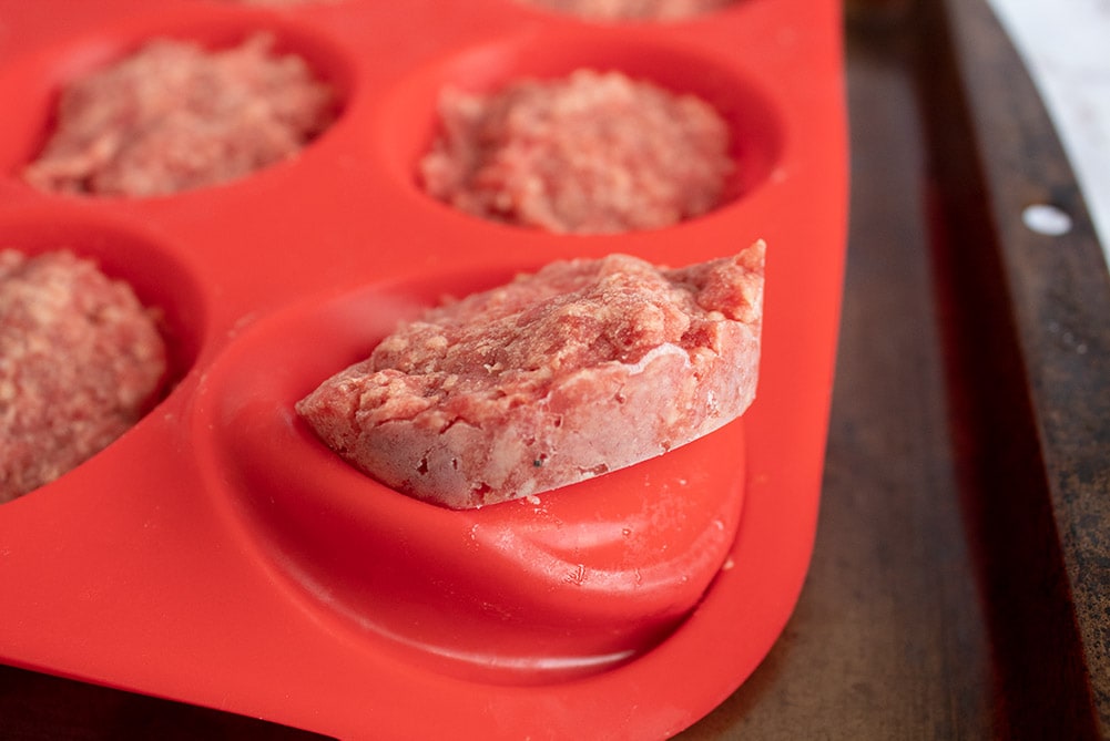 butter burgers popping out of red silicone muffin pan