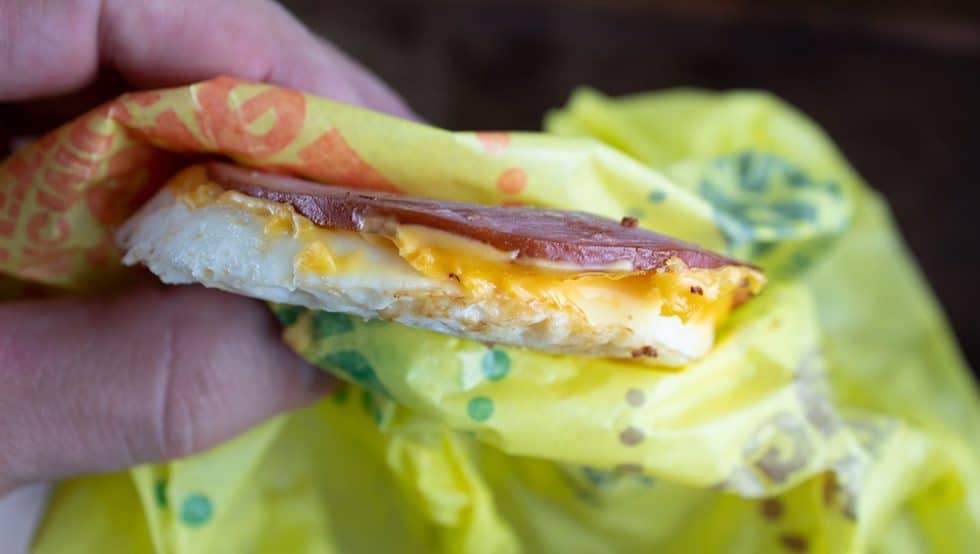 hand holding keto mcdonald's egg mcmuffin without a bun
