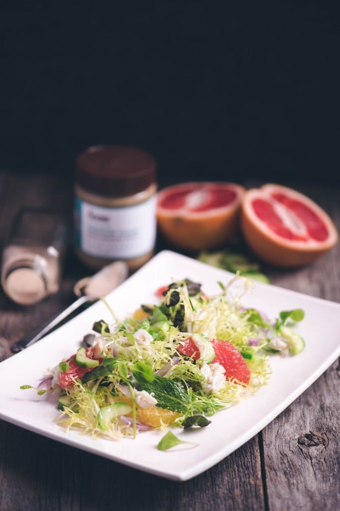 keto tahini vinaigrette dressing on salad on white plate