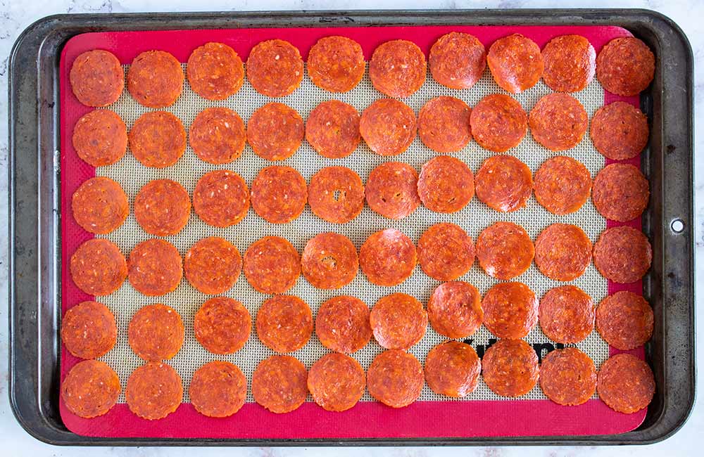 keto pepperoni chips on a baking sheet