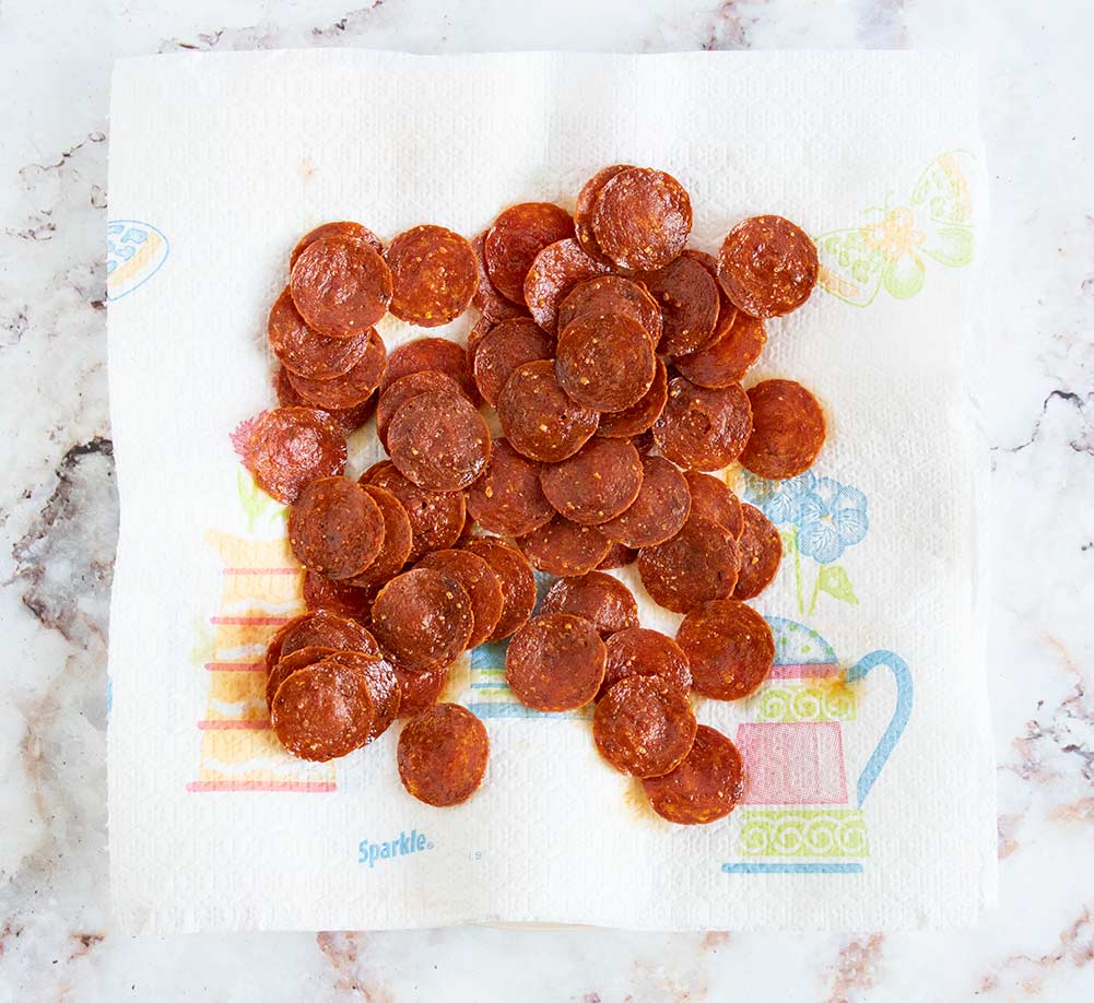 keto pepperoni chips on a paper towel with grease