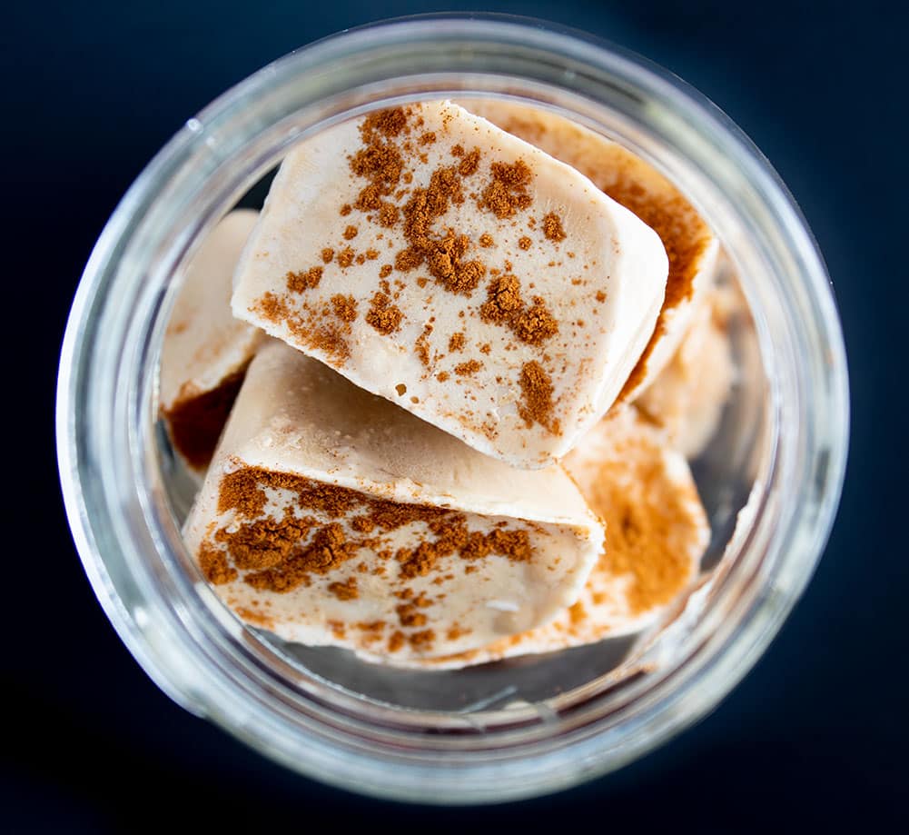 keto iced coffee cubes stacked on top of each other in a clear glass