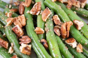 closeup of green beans keto with pecans on top