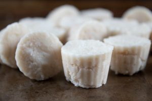 keto fat bombs recipe with maple and coconut sitting next to each other