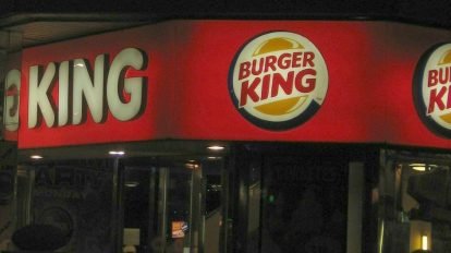 keto burger king restaurant outside in the dark with lit up logo