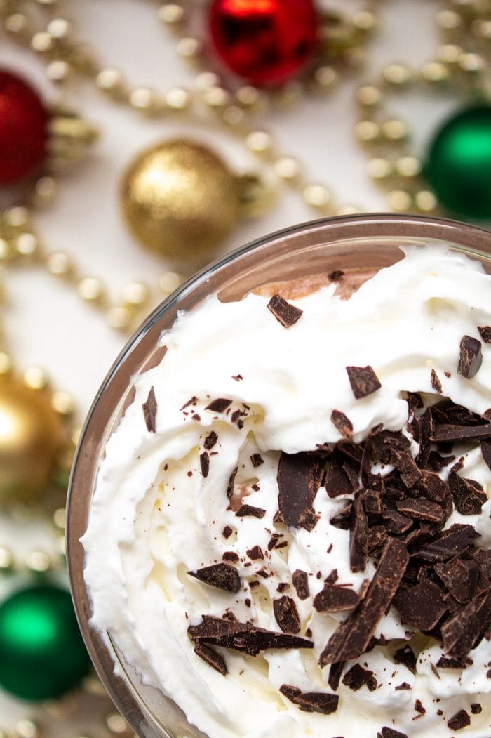 closeup overhead view of keto peppermint mocha with christmas decor on ground