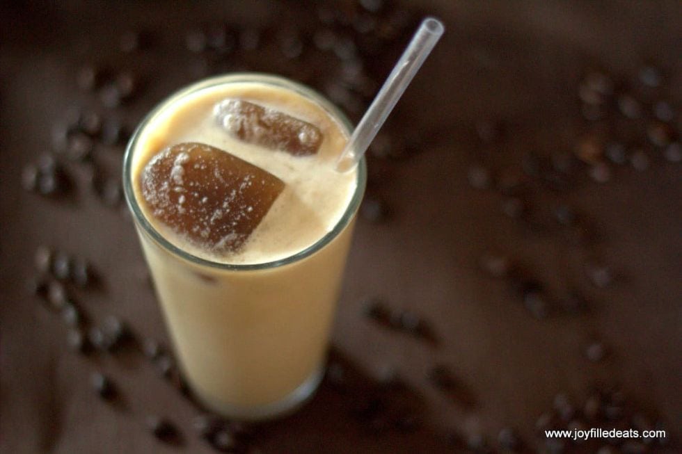 keto starbucks latte in a large cup with coffee ice cubes and a straw