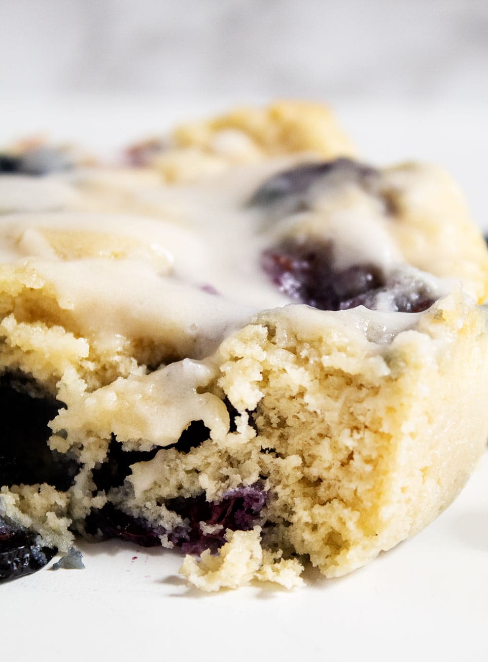 closeup of keto breakfast mug cake with glaze on top 