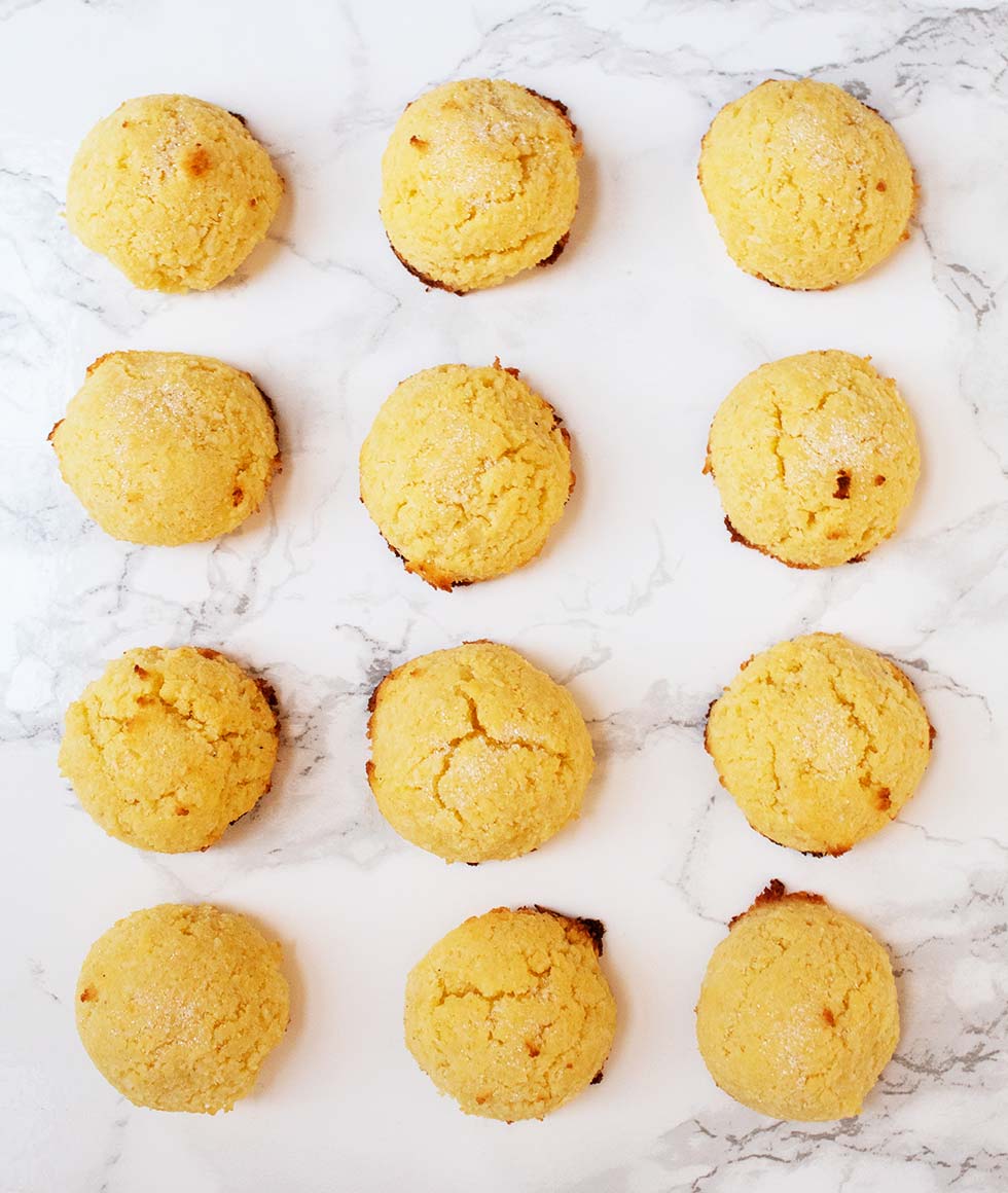 keto macaroons all laid out on a marble countertop