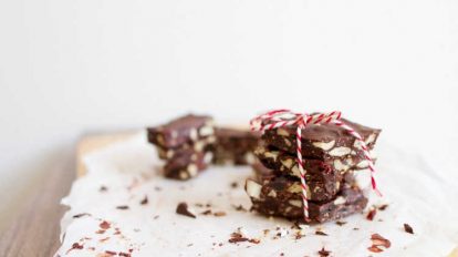 keto candy chocolate pieces stacked and tied with a red and white string