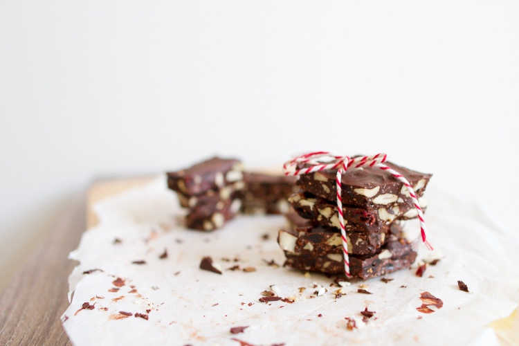 keto candy chocolate pieces stacked and tied with a red and white string