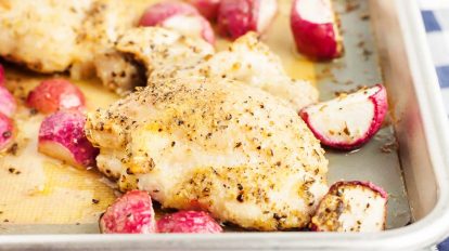 sheet pan chicken thighs with radishes on sheet pan after cooking
