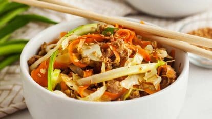 low carb egg roll in bowl with chopsticks