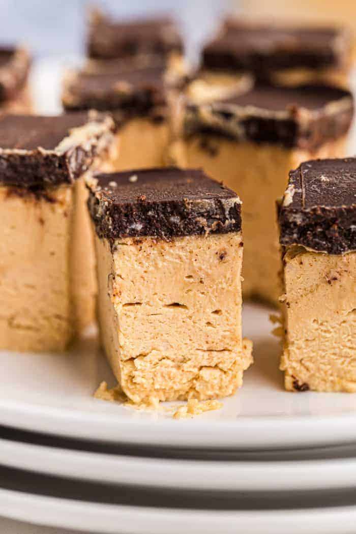 closeup of a keto peanut butter dessert piece with a chocolate topping