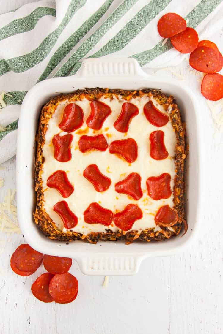 keto low carb pizza casserole in serving dish with pepperoni and cheese