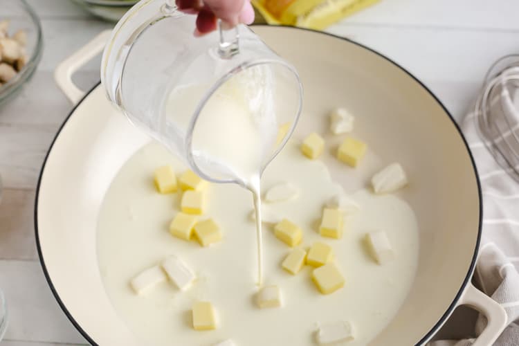 keto chicken alfredo milk and cheese in a mixing bowl