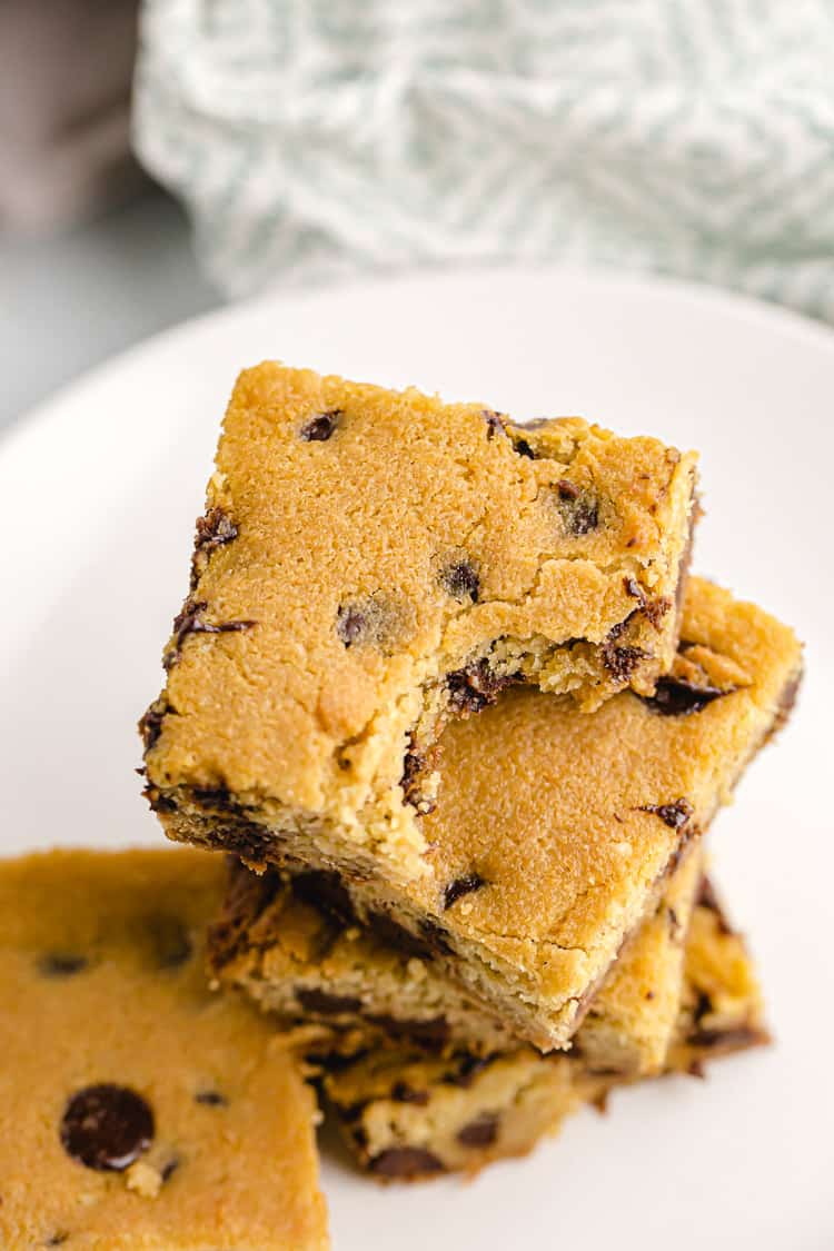 easy keto cookie casserole bars squares on dish with chocolate chips