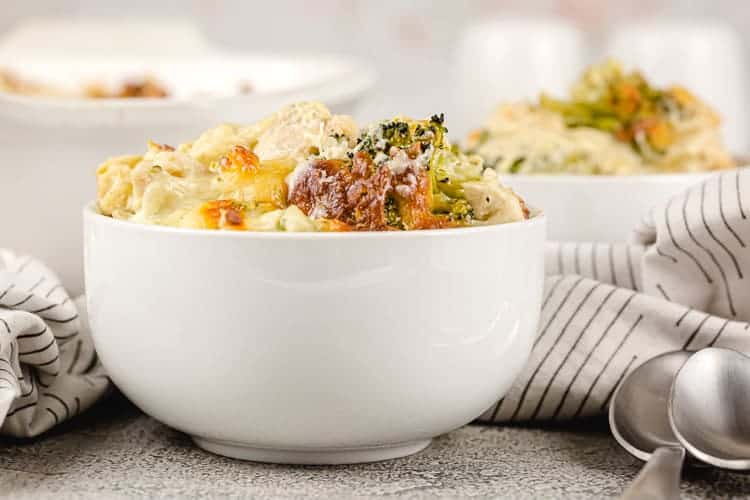 side view of individual portion of keto chicken broccoli casserole in a white bowl