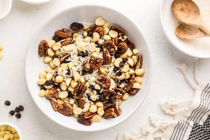 overhead view of large bowl with keto trail mix next to spoons