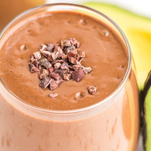 closeup of keto chocolate smoothie with cacao nibs sprinkled on top