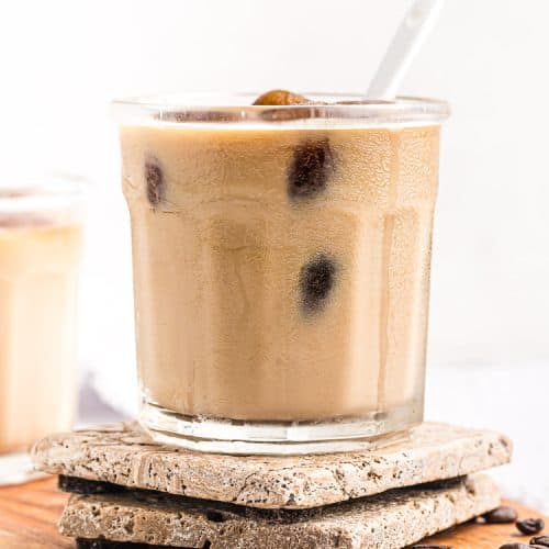 side view of keto easy iced coffee in a short glass with a spoon sticking out