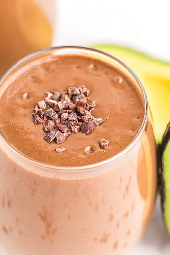 closeup of keto chocolate smoothie with cacao nibs sprinkled on top