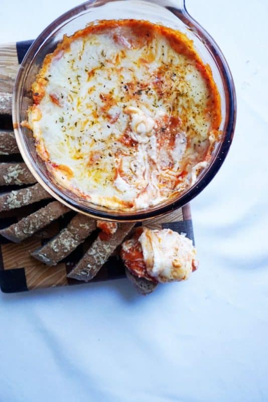 overhead view of a keto dip recipe made from pizza ingredients in a bowl