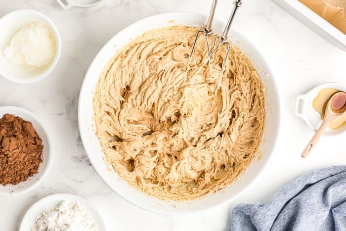 bowl containing whipped peanut butter base for keto bars