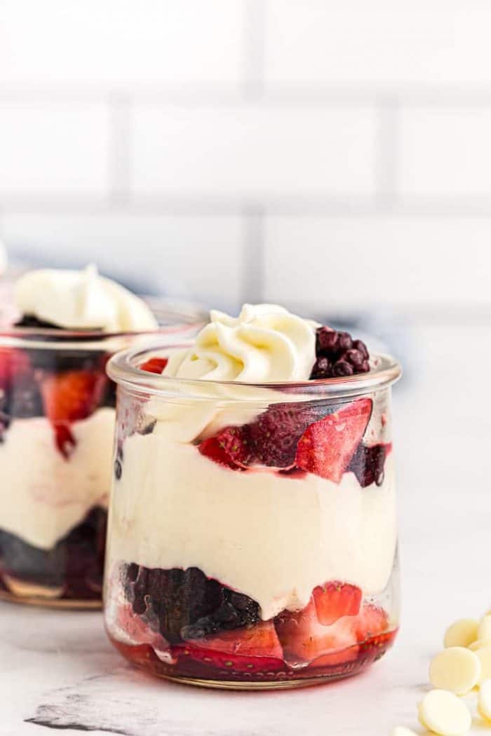 side view of small dish containing keto white chocolate mousse layered with berries