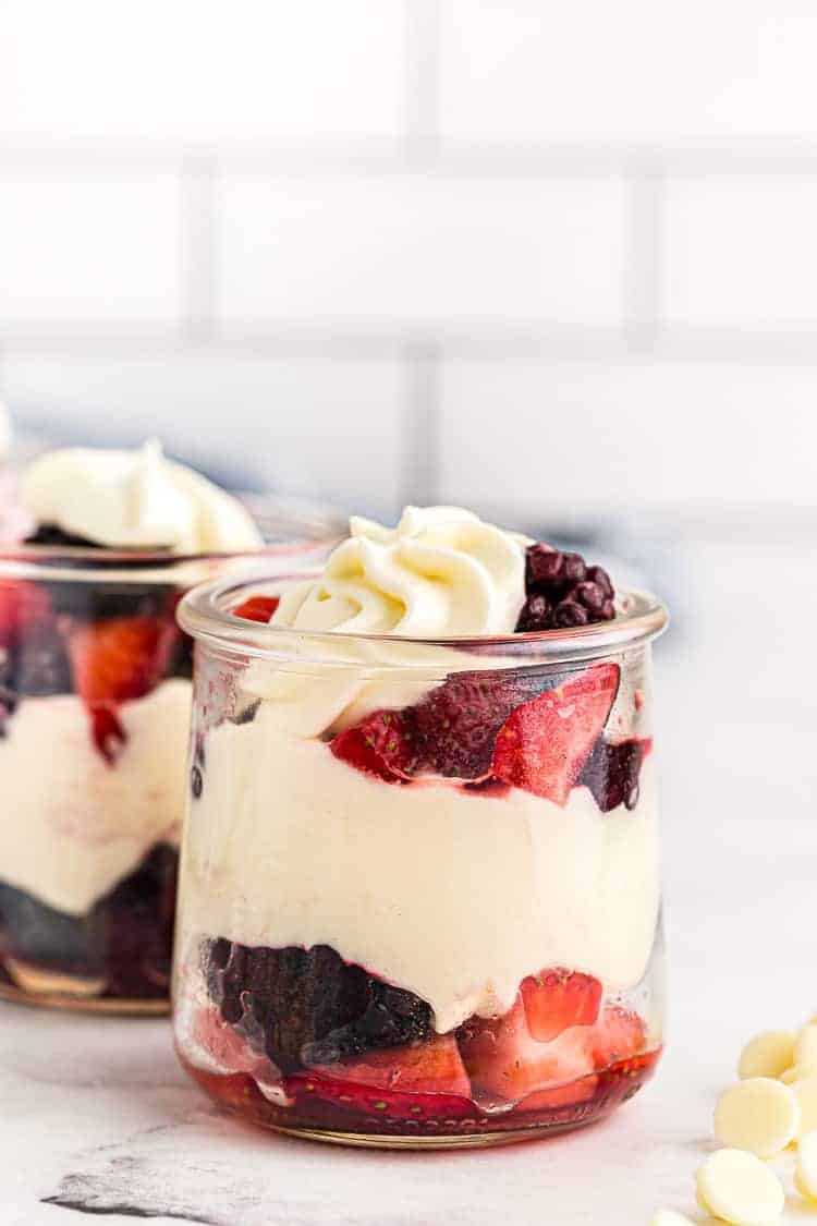 side view of small dish containing keto mousse layered with berries