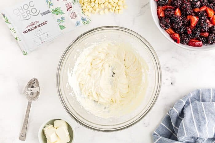overhead view of whipped cream in a bowl for keto white chocolate mousse recipe