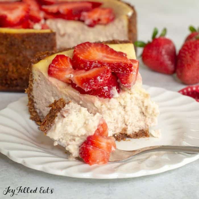 piece of keto strawberry cheesecake on a white plate