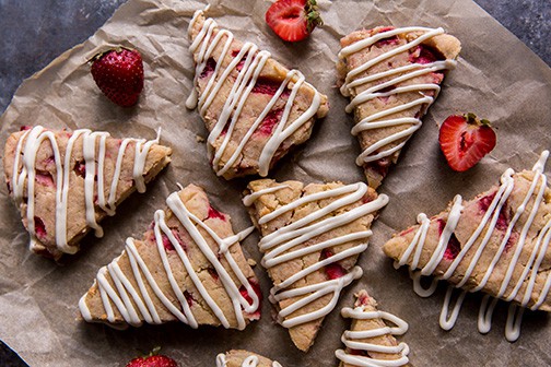 overhead view of keto strawberry scones with glaze icing drizzled on top