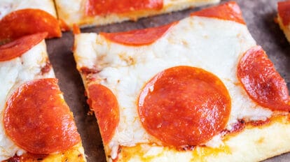 closeup of keto pepperoni pizza slices