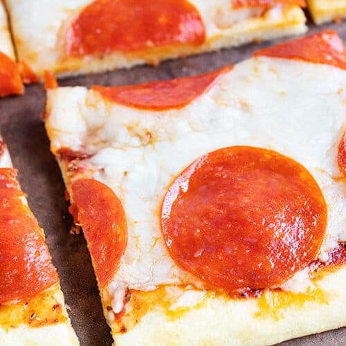 closeup of keto pepperoni pizza slices