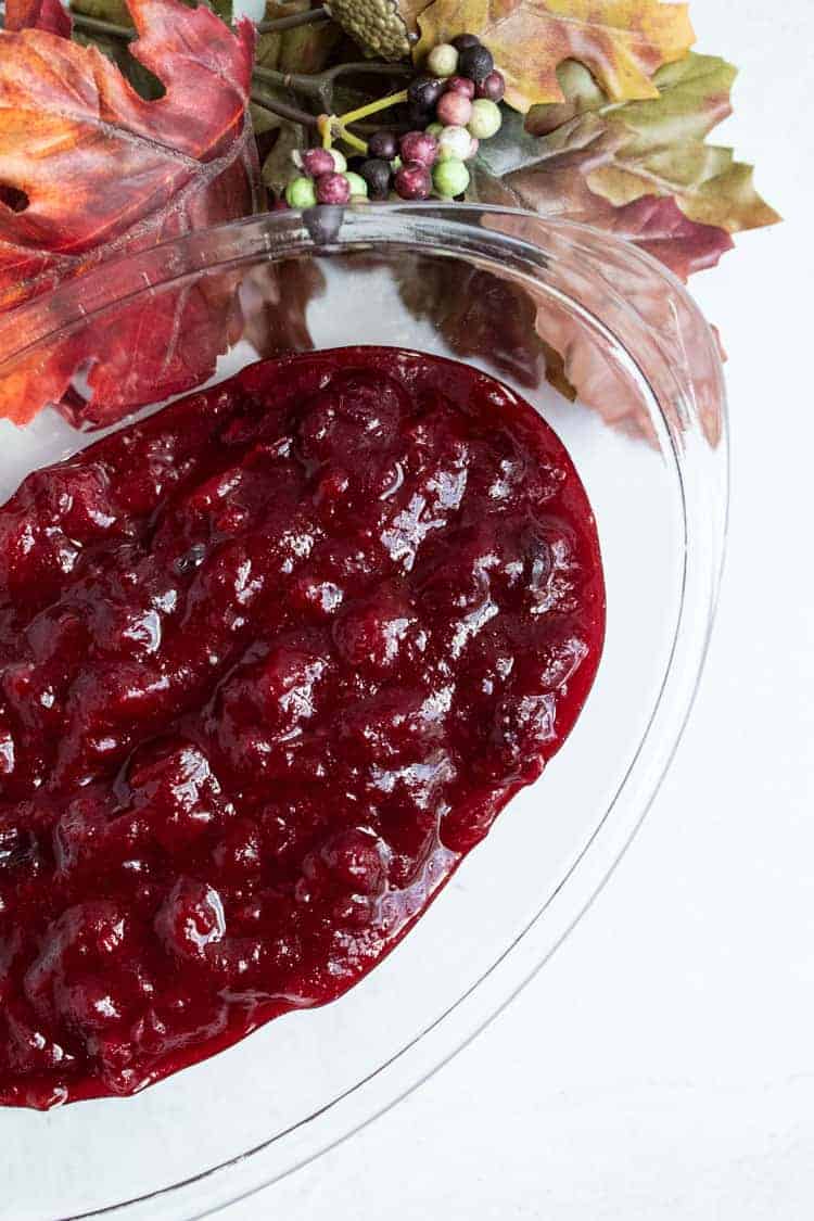 overhead view of bowl of keto cranberry sauce next to leaf decor