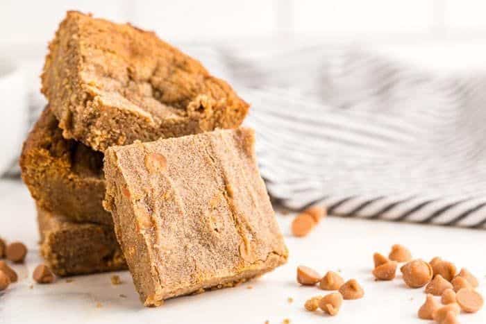 stack of keto butterscotch cookies on dish with butterscotch chips