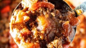ladle with big scoop of keto chili over pot