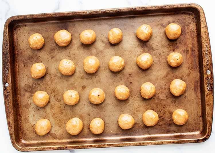 3 ingredient peanut butter balls on a baking tray