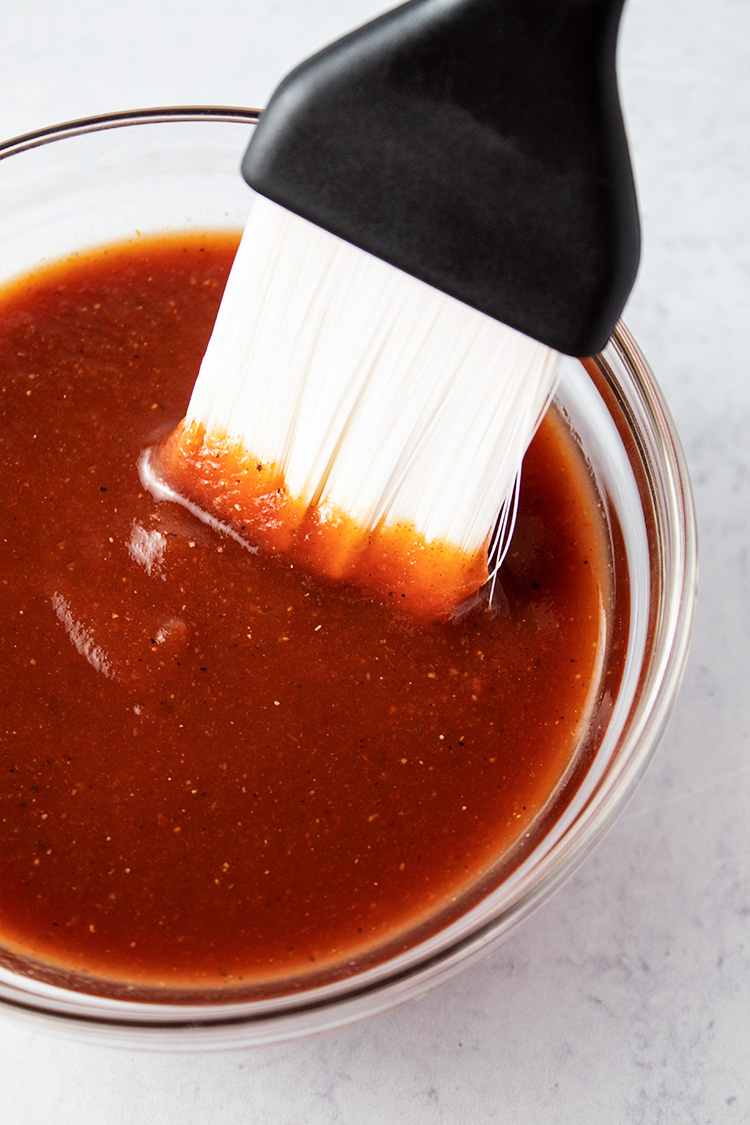 brush inside bowl of keto bbq sauce