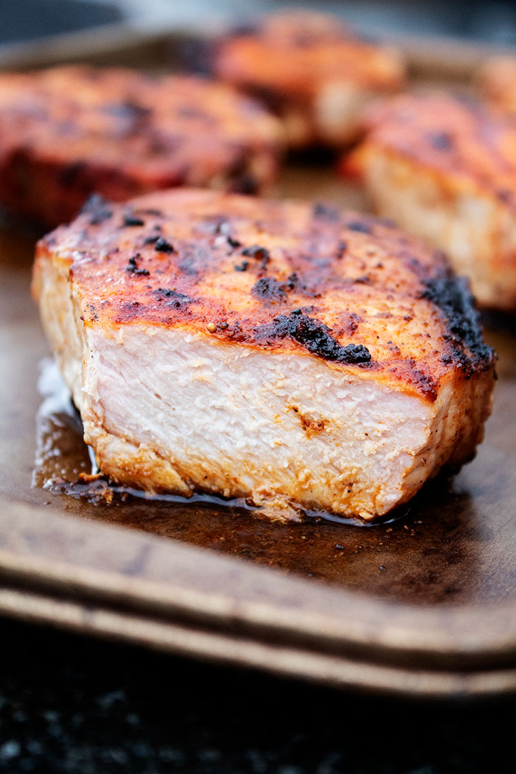 keto grilled pork chops sliced open on a baking sheet