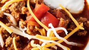 overhead view of low carb turkey chili with sour cream and cheese on top
