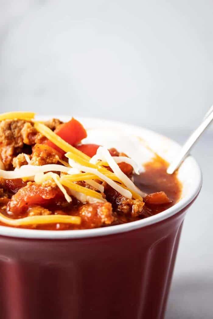 side of red bowl containing low carb turkey chili