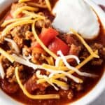 overhead view of low carb turkey chili with sour cream and cheese on top